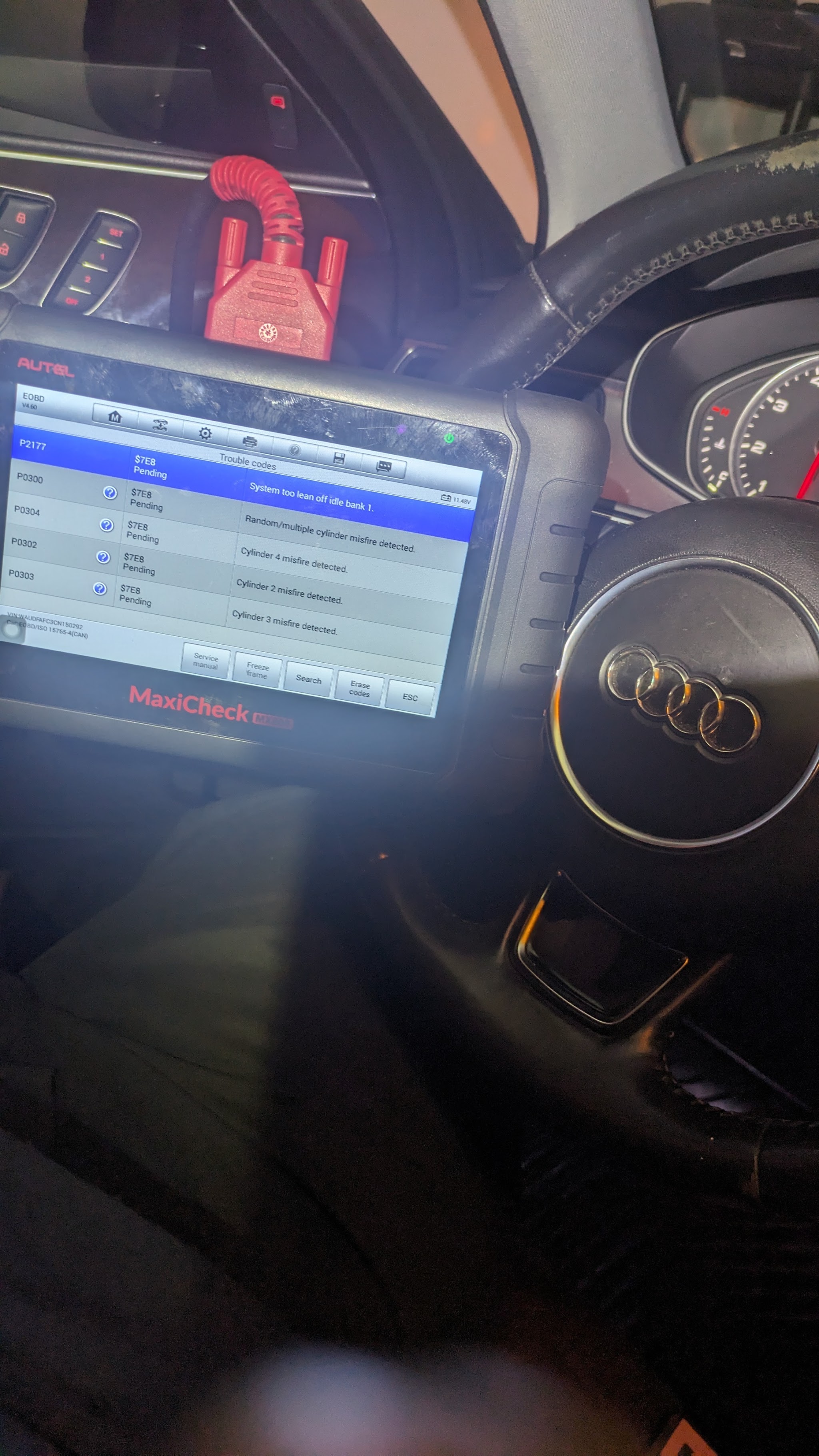 Scan tool showing trouble codes plugged into an Audi